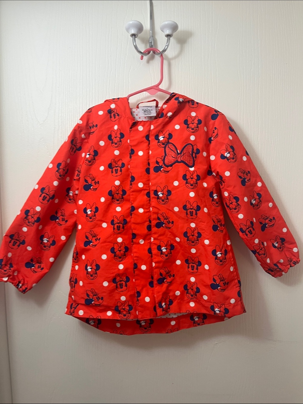 Red Minnie Mouse Polka Dot Rain Jacket folds onto self pouch